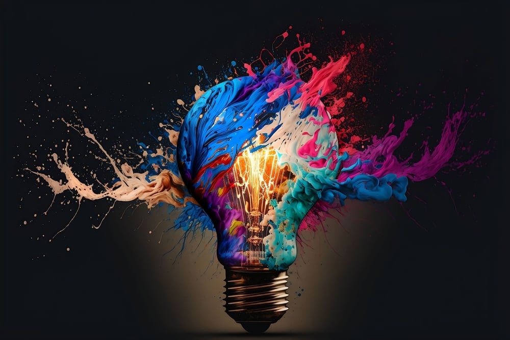 A colorful light bulb bursting with vibrant streams of light and color, symbolizing expanded human perception, integrated intelligence, creativity, and the emergence of new possibilities.
